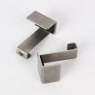 A pair of panel clips for hanging artworks by Absolute Products.