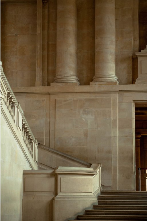 A stone stairwell inside the Place of Versailles.
