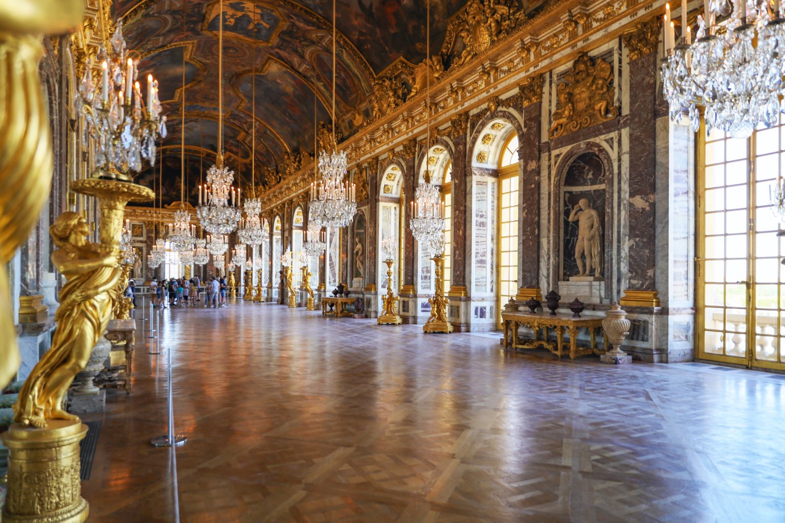Wide shot of the Hall of Mirrors, showcasing Absolute Freestanding Q Barriers being used to protect part of the room and its contents.