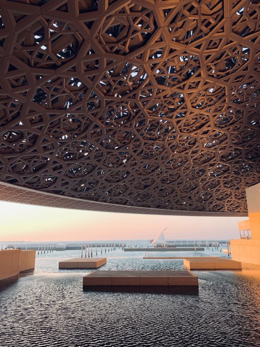 The domed roof of Louvre Abu Dhabi, covering a space where land meets sea. The domed roof of Louvre Abu Dhabi, covering a space where land meets sea.