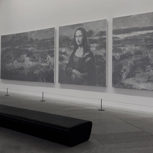 Series of paintings on display at Louvre Abu Dhabi, protected by museum barriers. Series of paintings on display at Louvre Abu Dhabi, protected by museum barriers.