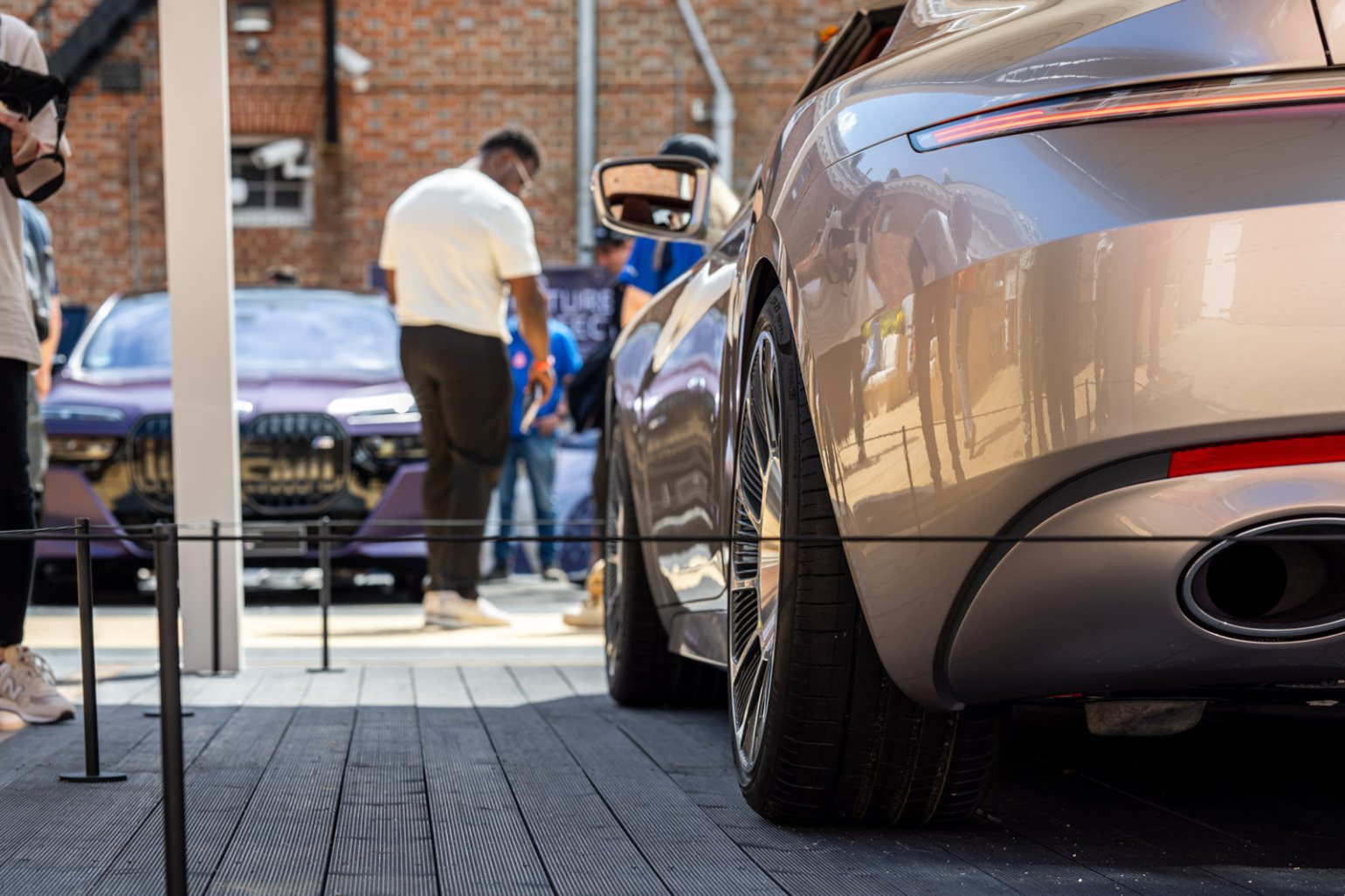 Silver sports car at Goodwood Festival of Speed, protected by Absolute Surface Mounted Barrier in black Silver sports car at Goodwood Festival of Speed, protected by Absolute Surface Mounted Barrier in black