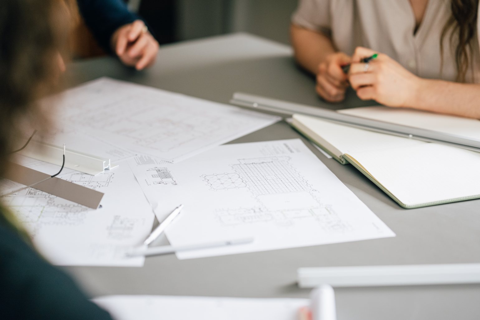 gallery architectural drawings and hanging track rails during planning meeting