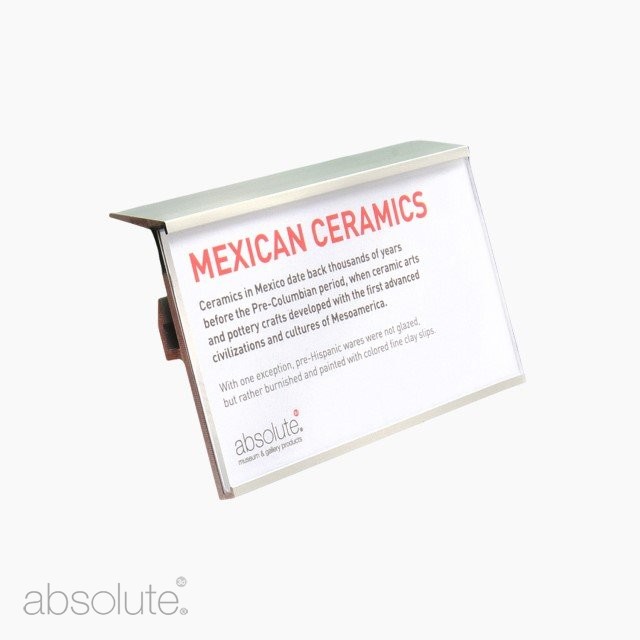 Shelf edge label holder displaying information about Mexican ceramics.