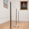 Absolute Freestanding Q Barriers in an art gallery, connected via two-lines of elasticated cord using Q Barrier Cuffs.