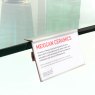 Shelf edge label holder in use on a shelf.