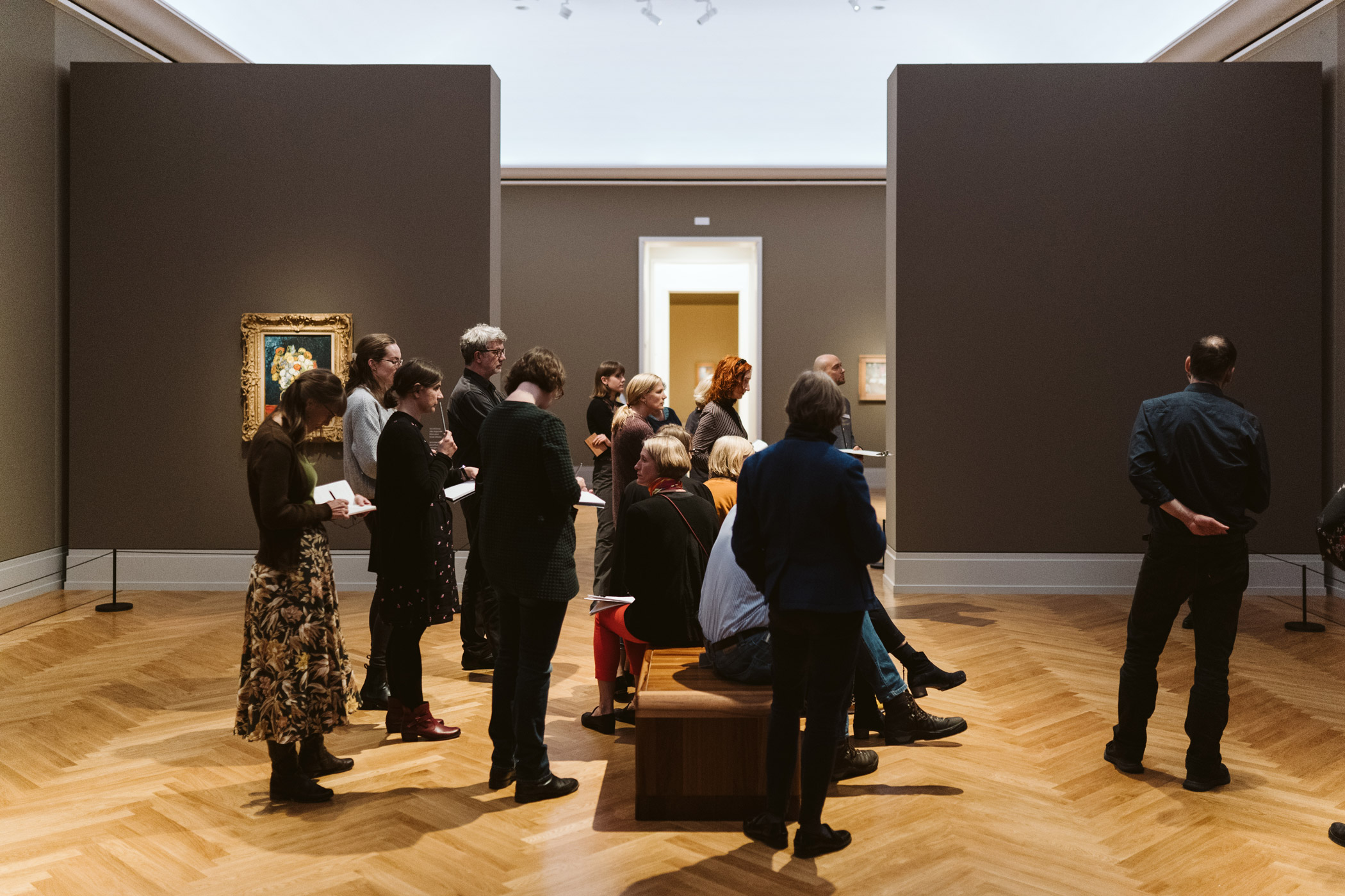 Group of people taking notes during a tour of the Museum Barberini, Potsdam.